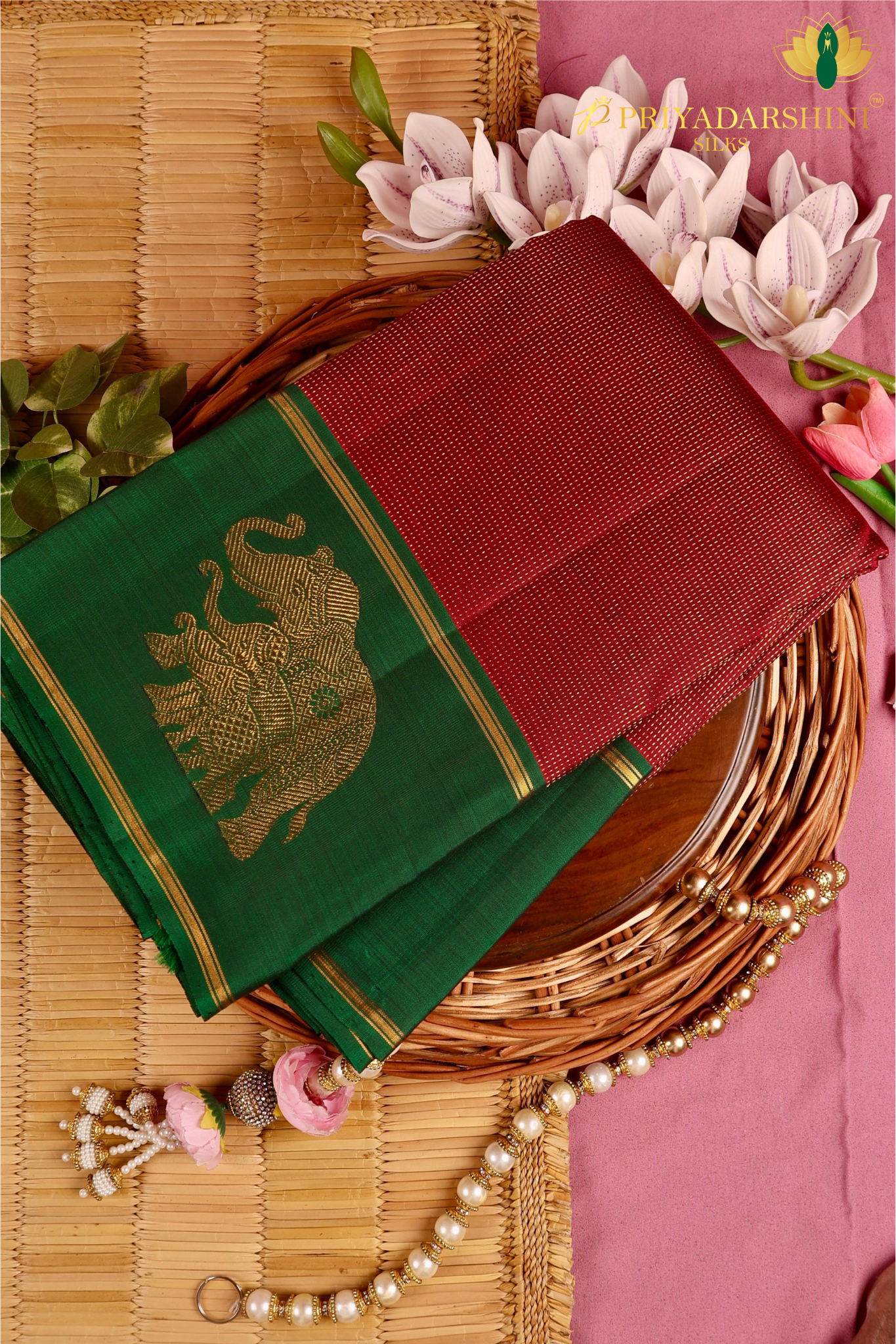 Kanchipuram Silk In Maroon With Elephant Zari Work Border