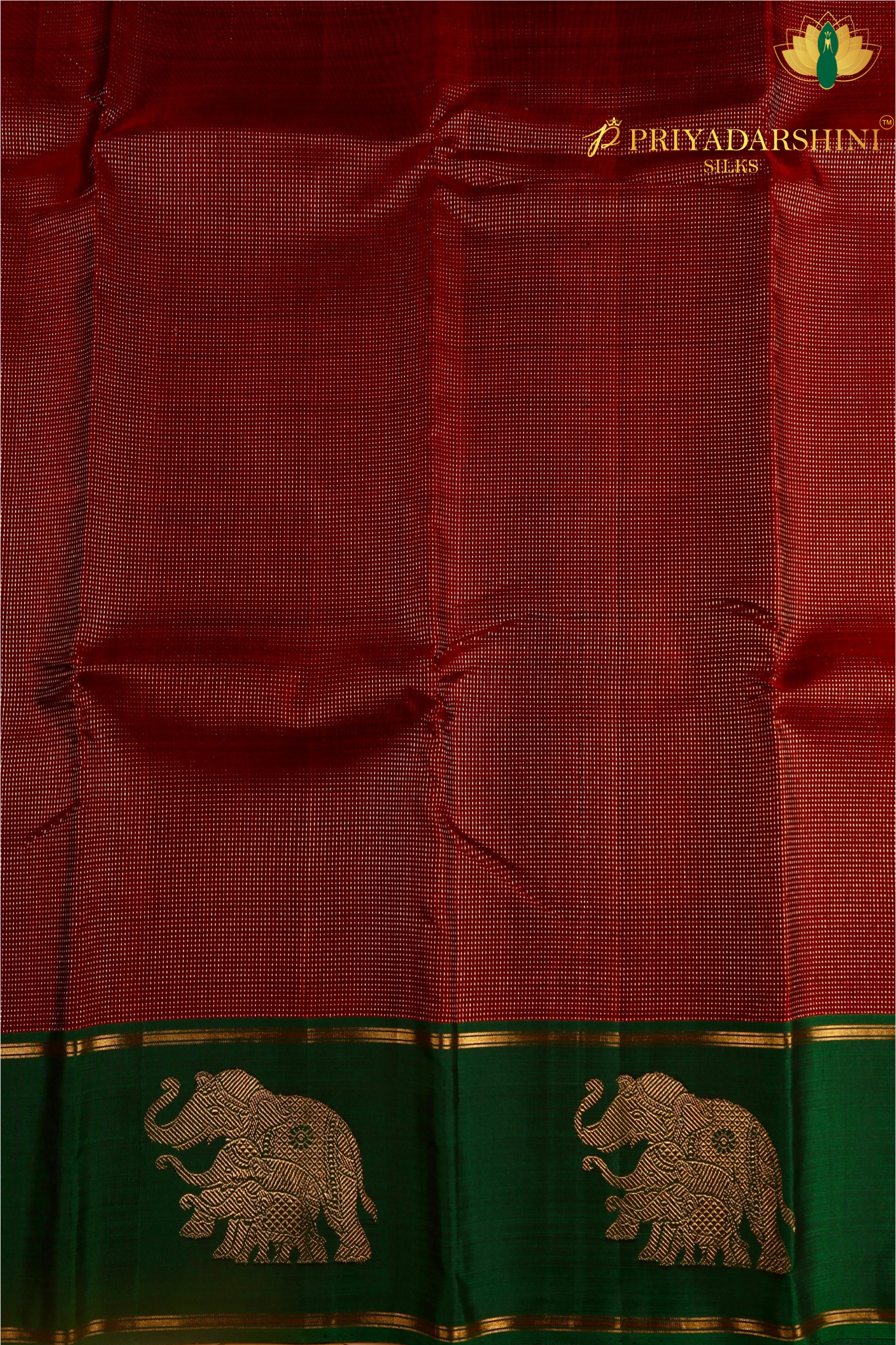 Kanchipuram Silk In Maroon With Elephant Zari Work Border