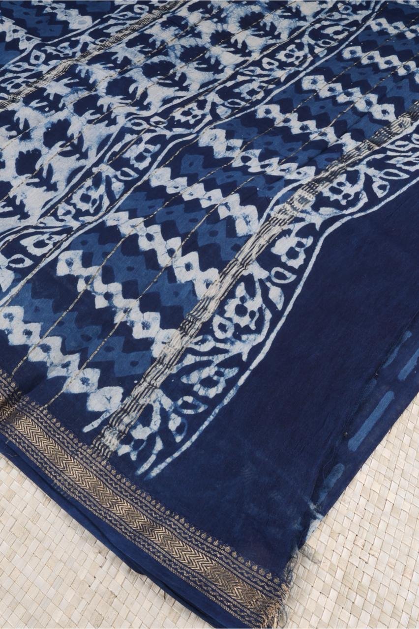 Blue Maheshwari silk cotton saree features a sophisticated interplay of vertical abstract block prints and a classic ornate border
