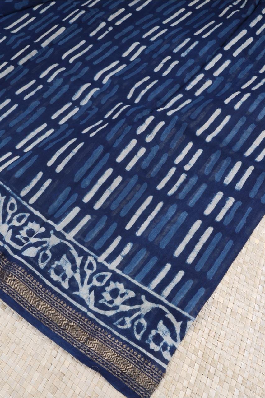 Blue Maheshwari silk cotton saree features a sophisticated interplay of vertical abstract block prints and a classic ornate border