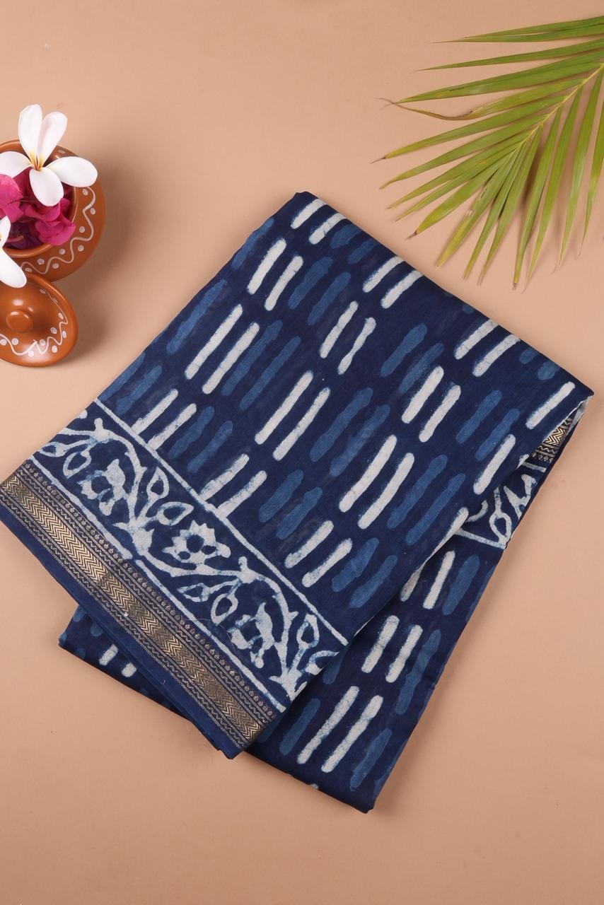 Blue Maheshwari silk cotton saree features a sophisticated interplay of vertical abstract block prints and a classic ornate border