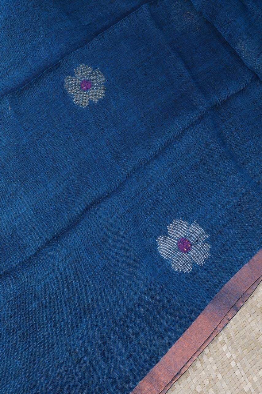 Blue linen saree featuring elegant silver and gold motifs