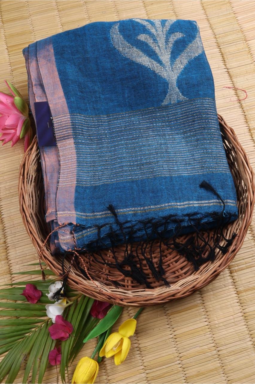 Blue linen saree featuring elegant silver and gold motifs
