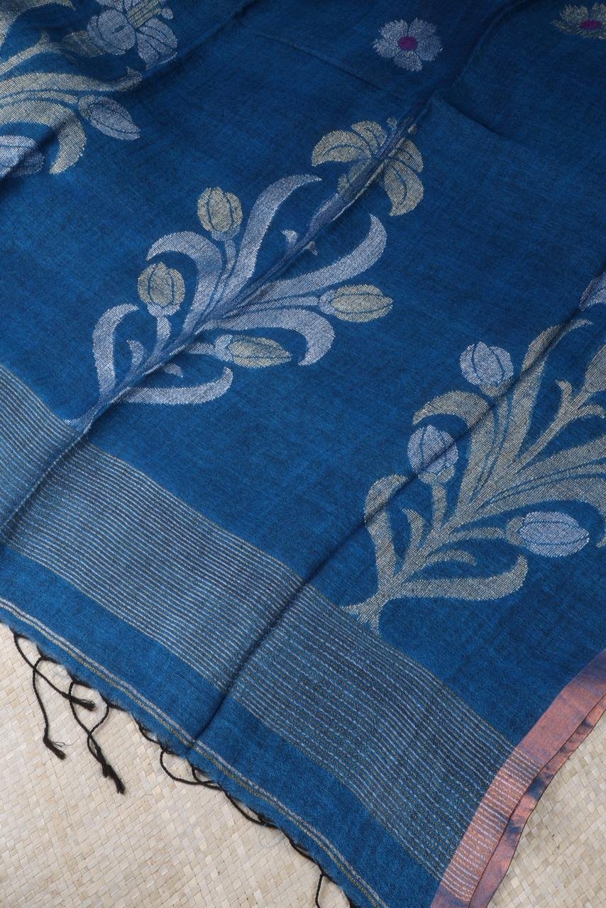 Blue linen saree featuring elegant silver and gold motifs