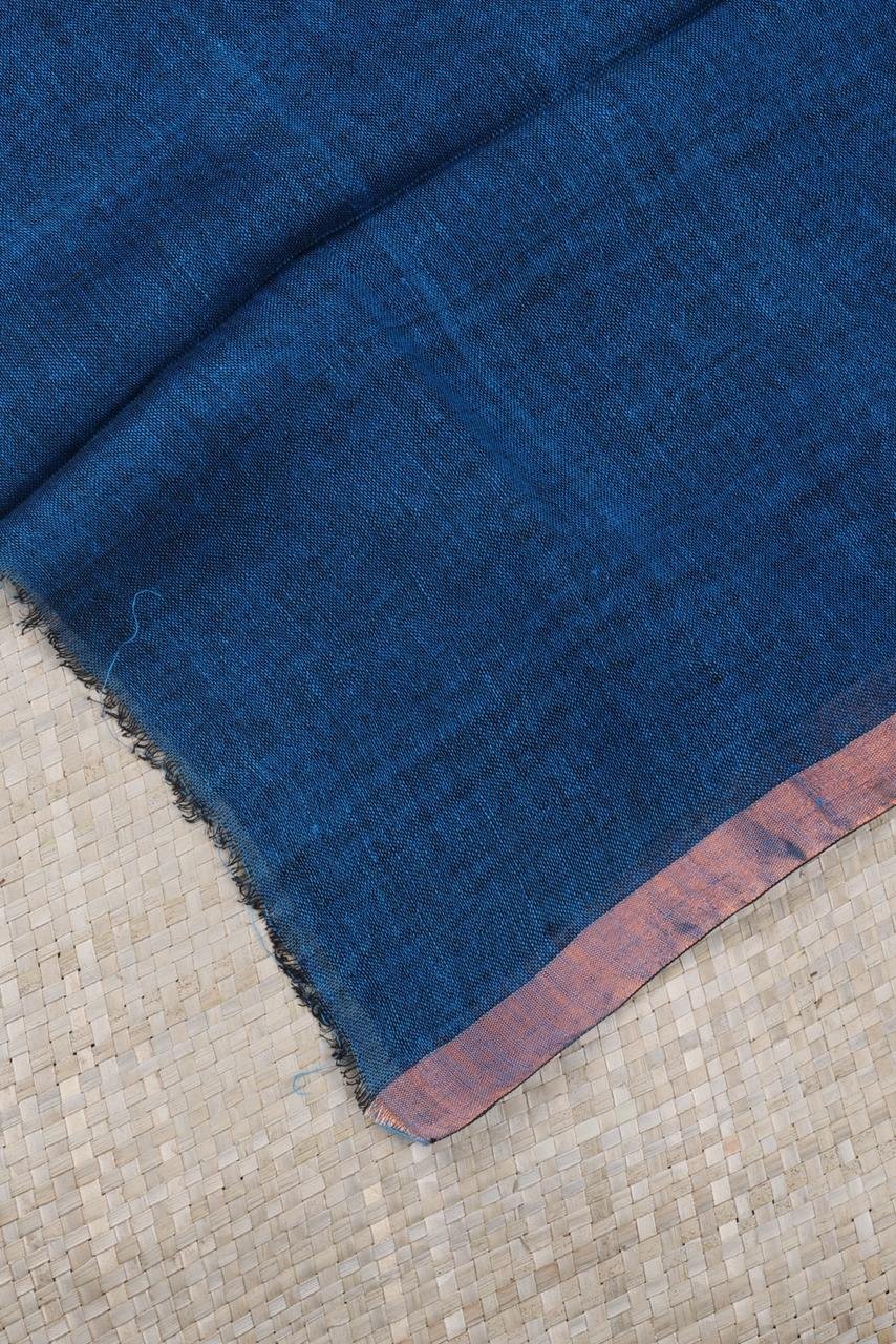 Blue linen saree featuring elegant silver and gold motifs