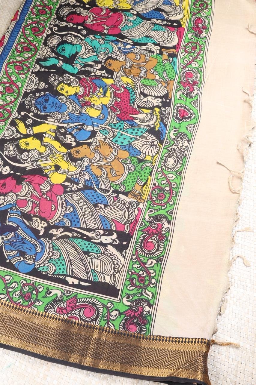 Classic black Kalamkari accented by a striking multi colored border with intricate gold zari work