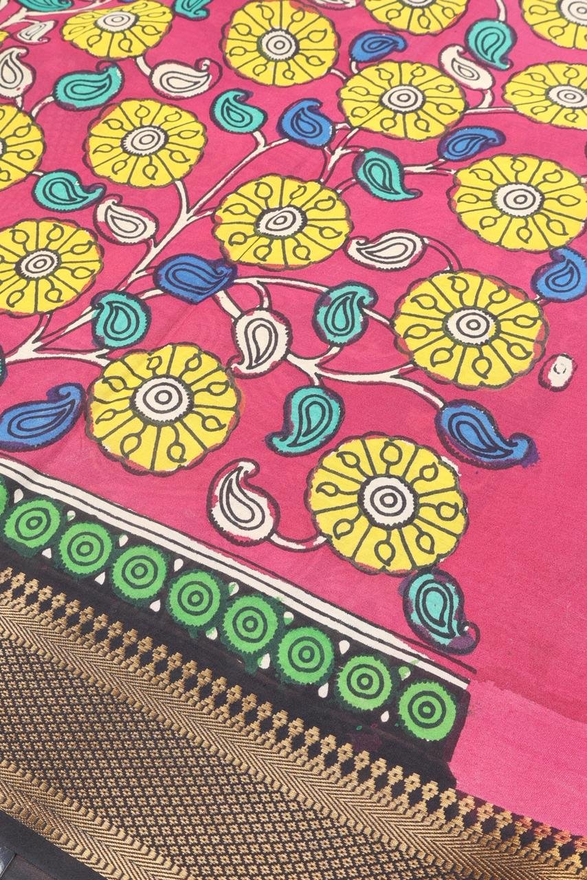 Classic black Kalamkari accented by a striking multi colored border with intricate gold zari work