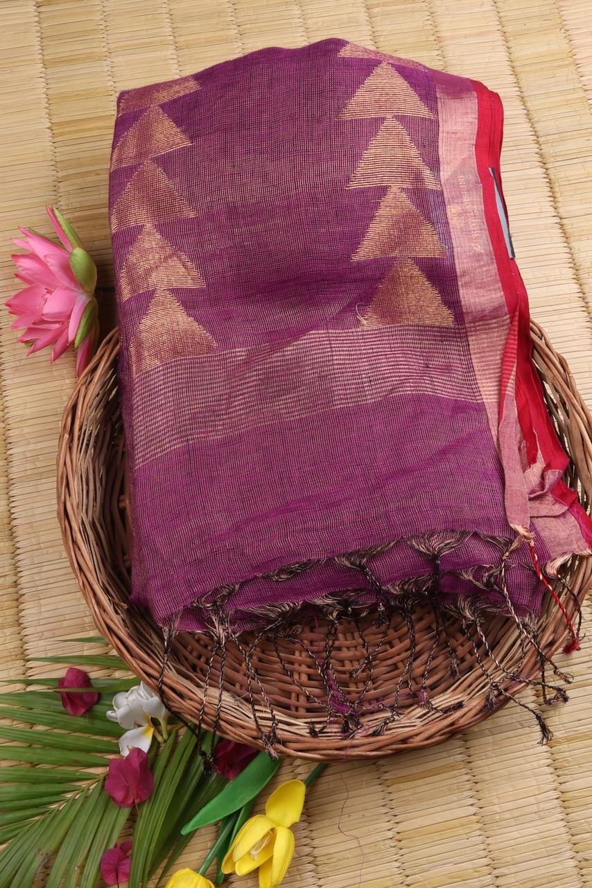 Magenta linen saree featuring a traditional gold Vairaoosi geometrical border