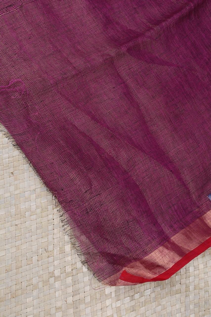 Magenta linen saree featuring a traditional gold Vairaoosi geometrical border
