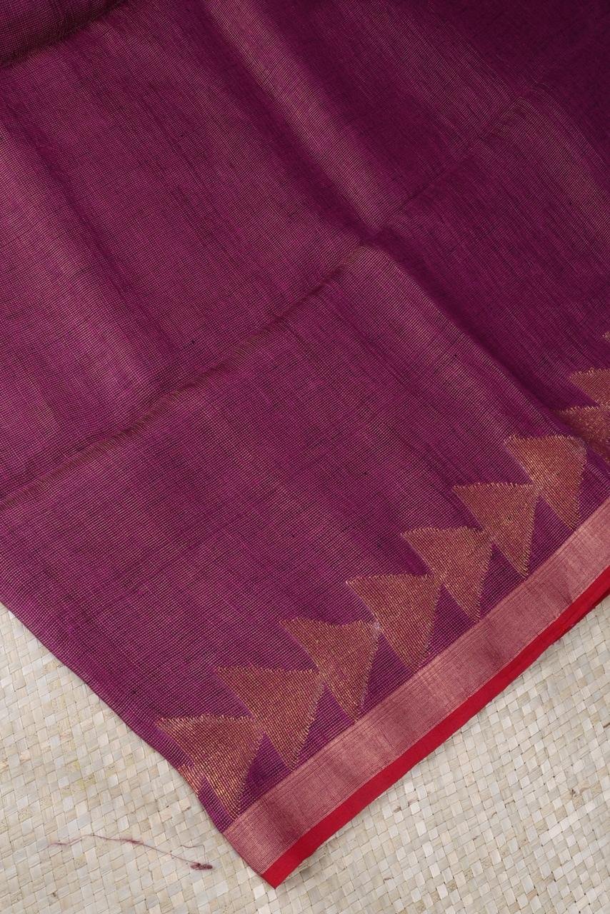 Magenta linen saree featuring a traditional gold Vairaoosi geometrical border
