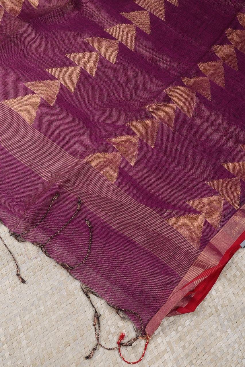 Magenta linen saree featuring a traditional gold Vairaoosi geometrical border