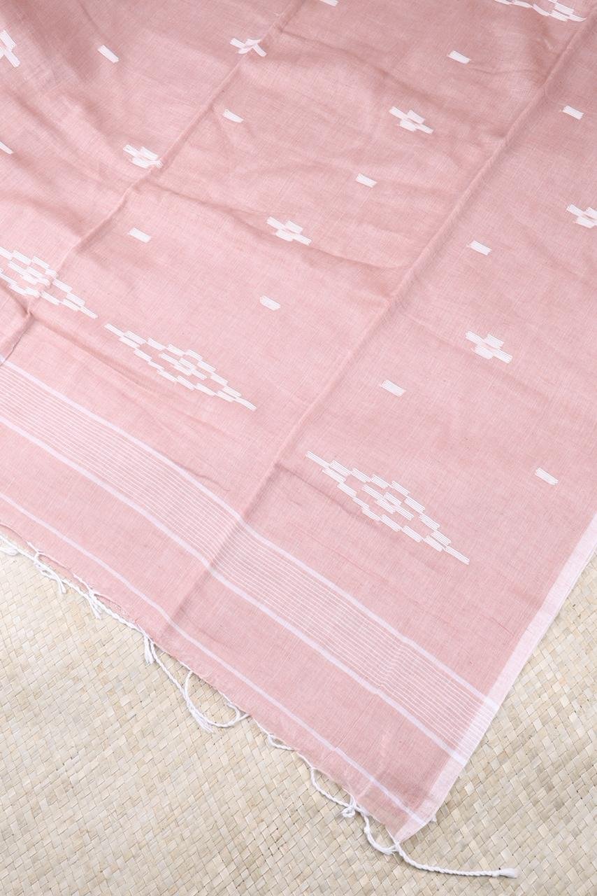 Mul Mul cotton saree features a sophisticated dusty mauve hue accented with clean white geometric motifs