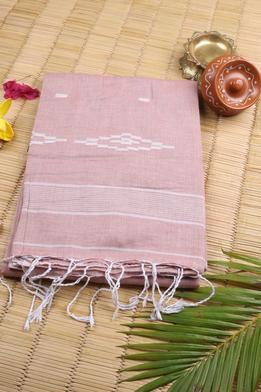 Mul Mul cotton saree features a sophisticated dusty mauve hue accented with clean white geometric motifs