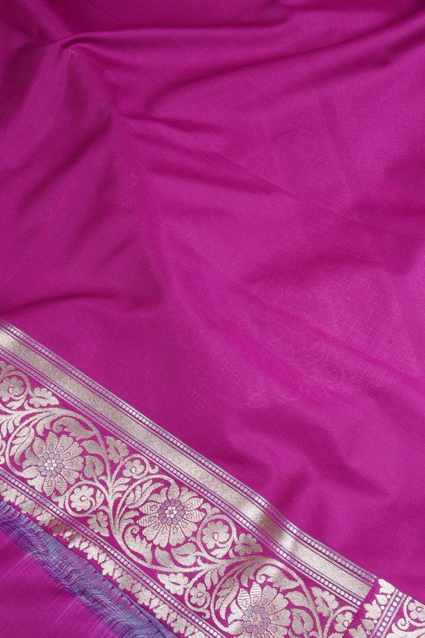 Purple Banarasi saree features intricate silver floral motifs woven throughout the body