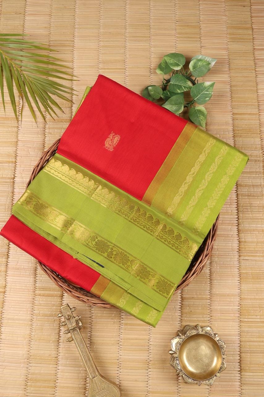 Vibrant Red Kanchi Silk Cotton saree body accented with a traditional golden peacock motif