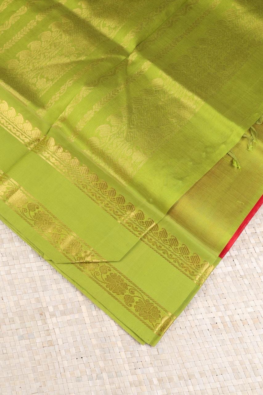 Vibrant Red Kanchi Silk Cotton saree body accented with a traditional golden peacock motif