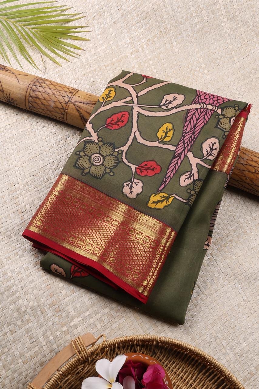 Vibrant leaf green base adorned with traditional hand painted Kalamkari motifs